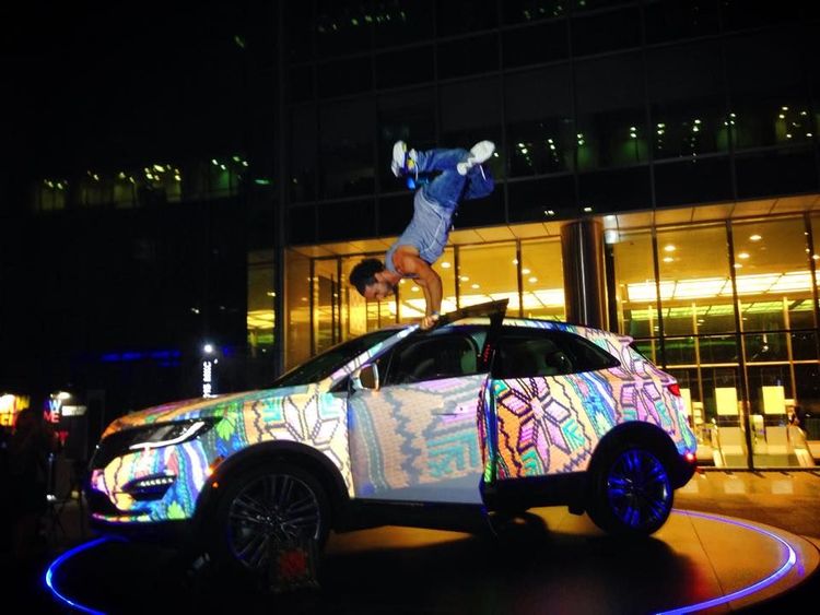 Man doing hand stand on lincoln